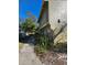 Side view of the townhome showing additional landscaping and a walkway at 7634 Desoto Ct, Tampa, FL 33615