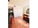 Kitchen with tile floors, an island with seating, and access to other rooms at 7634 Desoto Ct, Tampa, FL 33615