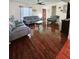 Spacious living room with hardwood floors and gray sofas at 7634 Desoto Ct, Tampa, FL 33615