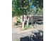 Covered carport parking with landscaping and a walkway at 7634 Desoto Ct, Tampa, FL 33615