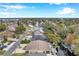 Aerial view highlighting a house's waterfront position in a canal-side community at 8 Citrus Dr, Palm Harbor, FL 34684