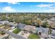 Aerial view of canal-front home with surrounding neighborhood and landscape at 8 Citrus Dr, Palm Harbor, FL 34684
