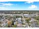 Aerial view showing home's location on canal, near shops and other houses at 8 Citrus Dr, Palm Harbor, FL 34684