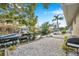 Charming backyard with patio, grill, and waterfront access at 8 Citrus Dr, Palm Harbor, FL 34684