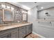Modern bathroom with granite vanity and walk-in shower at 8 Citrus Dr, Palm Harbor, FL 34684