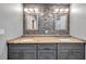 Double sink bathroom with granite countertop and modern cabinets at 8 Citrus Dr, Palm Harbor, FL 34684