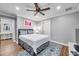 Comfortable bedroom with queen bed and access to bathroom at 8 Citrus Dr, Palm Harbor, FL 34684