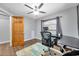 Home office with wood flooring, ceiling fan and large window at 8 Citrus Dr, Palm Harbor, FL 34684