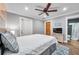 Main bedroom with ensuite bathroom and large TV at 8 Citrus Dr, Palm Harbor, FL 34684