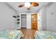 Cozy bedroom with twin beds, wood floors, and ample closet space at 8 Citrus Dr, Palm Harbor, FL 34684