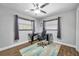 Home office with wood flooring, ceiling fan and large window at 8 Citrus Dr, Palm Harbor, FL 34684