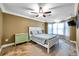 Guest bedroom with bay window and ceiling fan at 8 Citrus Dr, Palm Harbor, FL 34684