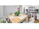 Bright dining area with a square wooden table and four patterned chairs at 8 Citrus Dr, Palm Harbor, FL 34684