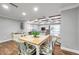 Casual dining area with light wood table and patterned chairs at 8 Citrus Dr, Palm Harbor, FL 34684