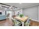 Bright dining area with light wood table and colorful chairs at 8 Citrus Dr, Palm Harbor, FL 34684