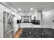 Bright kitchen with stainless steel appliances and granite countertops at 8 Citrus Dr, Palm Harbor, FL 34684