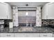 Clean and bright kitchen with granite countertops and updated sink at 8 Citrus Dr, Palm Harbor, FL 34684