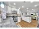 Modern kitchen with stainless steel appliances and granite countertops at 8 Citrus Dr, Palm Harbor, FL 34684