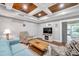 Living room features wood accent ceiling and plenty of natural light at 8 Citrus Dr, Palm Harbor, FL 34684
