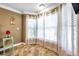 Bright sitting area with large windows and sheer curtains at 8 Citrus Dr, Palm Harbor, FL 34684