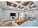 Bright living room with wood accent ceiling, comfy seating, and fireplace at 8 Citrus Dr, Palm Harbor, FL 34684