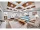 Living room with a blue couch and coffered ceiling at 8 Citrus Dr, Palm Harbor, FL 34684
