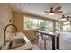 Outdoor kitchen with granite countertops and sink at 8 Citrus Dr, Palm Harbor, FL 34684