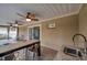 Outdoor kitchen with granite countertop and sink at 8 Citrus Dr, Palm Harbor, FL 34684