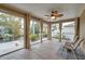 Relaxing screened porch with ceiling fans and waterfront views at 8 Citrus Dr, Palm Harbor, FL 34684