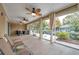 Spacious screened porch featuring a wet bar and seating area at 8 Citrus Dr, Palm Harbor, FL 34684
