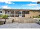 Bright screened porch with steps down to the dock at 8 Citrus Dr, Palm Harbor, FL 34684
