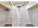 Spacious walk-in closet with bi-fold doors and shelving at 8 Citrus Dr, Palm Harbor, FL 34684