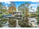 Peaceful waterfront view of canal and house reflection at 8 Citrus Dr, Palm Harbor, FL 34684