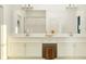 Double vanity bathroom with a large mirror and walk-in shower at 9650 Minnow Ray Dr, Land O Lakes, FL 34638