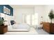 Spacious bedroom with a king-size bed and wood dresser at 9650 Minnow Ray Dr, Land O Lakes, FL 34638