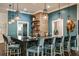 Community bar with hexagonal tile and pendant lighting at 9650 Minnow Ray Dr, Land O Lakes, FL 34638