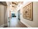 Bright hallway with modern artwork and lighting at 9650 Minnow Ray Dr, Land O Lakes, FL 34638