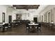 Community room with tables, chairs, and a bar at 9650 Minnow Ray Dr, Land O Lakes, FL 34638
