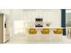 Kitchen with white cabinets and an island with seating at 9650 Minnow Ray Dr, Land O Lakes, FL 34638