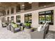 Relaxing outdoor lounge area with wicker chairs and a coffee table at 9650 Minnow Ray Dr, Land O Lakes, FL 34638