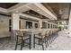 Community outdoor bar with seating and tile accents at 9650 Minnow Ray Dr, Land O Lakes, FL 34638