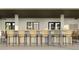 Outdoor bar with wicker barstools and tile backsplash at 9650 Minnow Ray Dr, Land O Lakes, FL 34638
