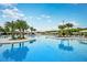 Large resort-style pool with plenty of lounge chairs at 9650 Minnow Ray Dr, Land O Lakes, FL 34638