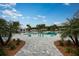 Stunning pool with a relaxing patio and landscaping at 9650 Minnow Ray Dr, Land O Lakes, FL 34638