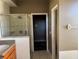 Bathroom with shower, vanity, and linen closet at 11321 Flora Springs Dr, Riverview, FL 33579