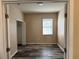 Spacious bedroom with wood-look floors and closet at 11321 Flora Springs Dr, Riverview, FL 33579