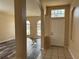 Bright entryway with tiled flooring and views into the living room at 11321 Flora Springs Dr, Riverview, FL 33579