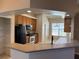 Modern kitchen with black appliances and a large pantry at 11321 Flora Springs Dr, Riverview, FL 33579