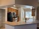 Modern kitchen with black appliances and a large pantry at 11321 Flora Springs Dr, Riverview, FL 33579