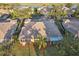 Aerial view of a house with a backyard in a community at 1141 Jameson Greens Dr # 3, Sun City Center, FL 33573